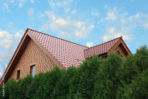 Wallpaper Mural Beautiful house with red roof against blue sky Torontodigital.ca