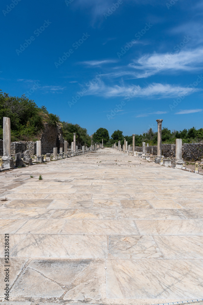 Street of the city of Ephesus, with the marble columns on the sides, on a sunny day