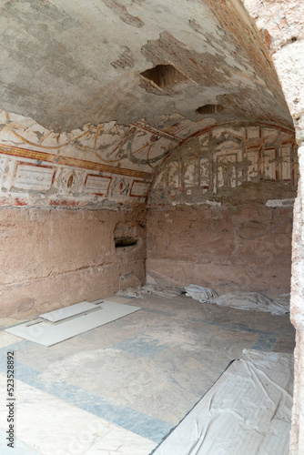 Interior of the excavations at Ephesus, with the ruined ancient houses and exposed mosaics.