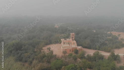 Aerial View Of Building In Morning Mist At Mehrano Wildlife Sanctuary. Orbit Motion photo