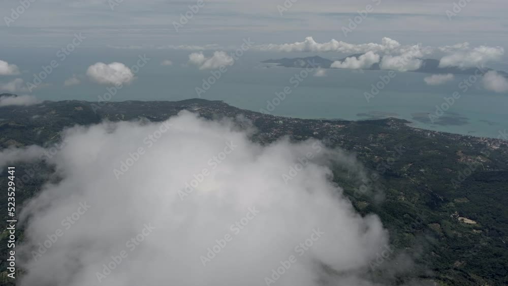 Drone capture time lapse of clouds of the central part of Ko Samui island in Thailand - Mid day light - ocean view and jungle - camera pans left Drone capture time lapse of clouds of the central part of Ko Samui island in Thailand - Mid day light - ocean view and jungle - camera pans left
