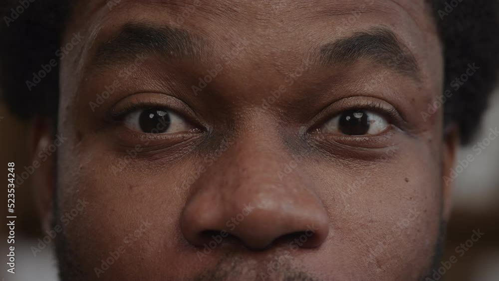 Surprised african american man eyes with his eyebrows up and blinking Surprised african american man eyes with his eyebrows up and blinking