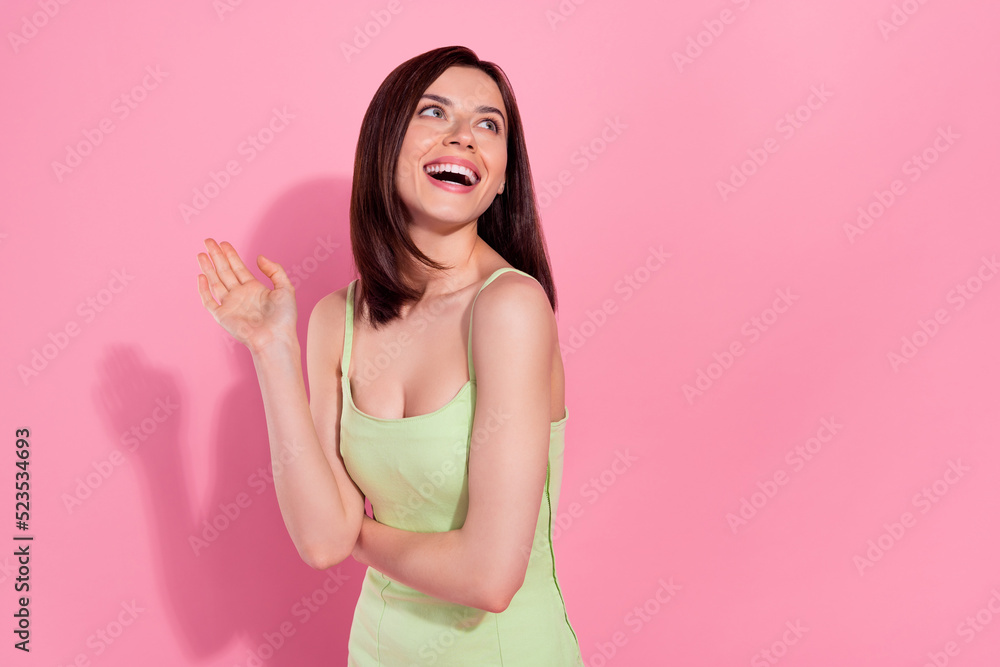 Portrait of sweet cute lady stand interested look empty space banner enjoy news shopping sale discount isolated on pink color background Portrait of sweet cute lady stand interested look empty space banner enjoy news shopping sale discount isolated on pink color background