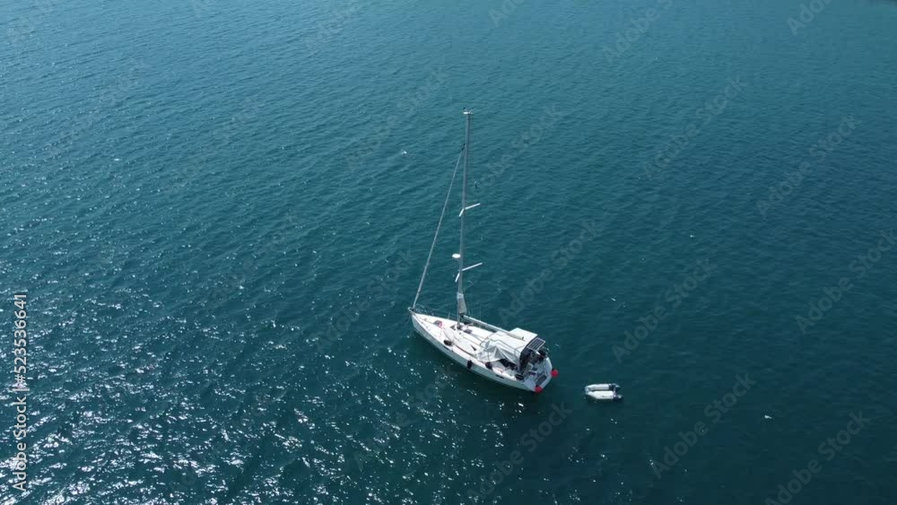 anchored tourist boats on the calm waters of the Adriatic Sea, Croatia, morning, mid-summer, no wind, view from a drone anchored tourist boats on the calm waters of the Adriatic Sea, Croatia, morning, mid-summer, no wind, view from a drone