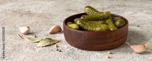 a bowl of gherkins on a light table