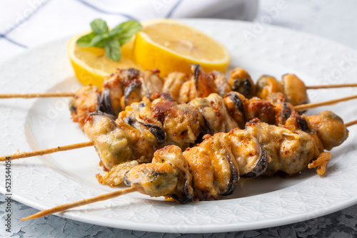 Fried mussels, delicious skewered mussels (Turkish name; midye tava, cöp sis midye)