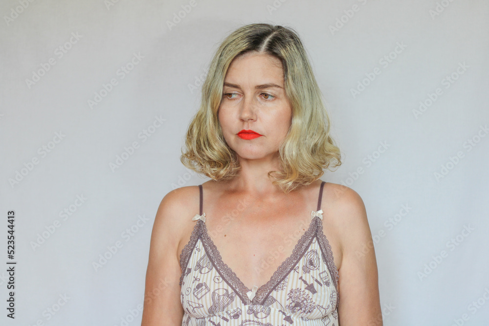 Beautiful middle-aged blond woman on a white background Beautiful middle-aged blond woman on a white background
