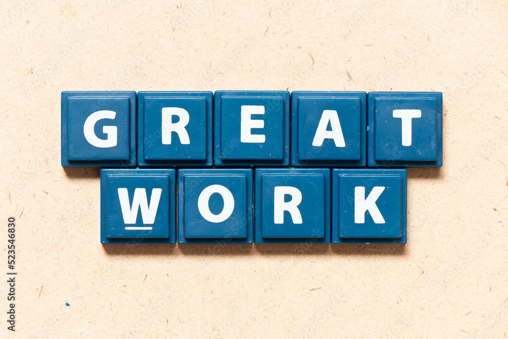 Tile letter in english word great work on wood background Tile letter in english word great work on wood background