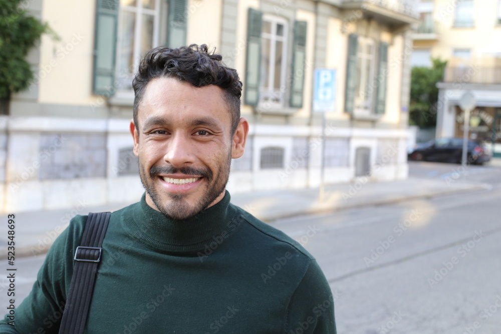Handsome entrepreneur walking around with elegant turtle neck shirt Handsome entrepreneur walking around with elegant turtle neck shirt