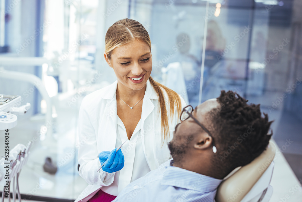 Obraz premium A perfect result of a dentist’s work which is seen in the beautiful and white smile on a patient who is absolutely satisfied with a result of a treatment given in a clinic. 
