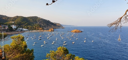 Tossa de Mar Spain July 2022 beautiful golden hour view over Tossa town from castle over bay with boats