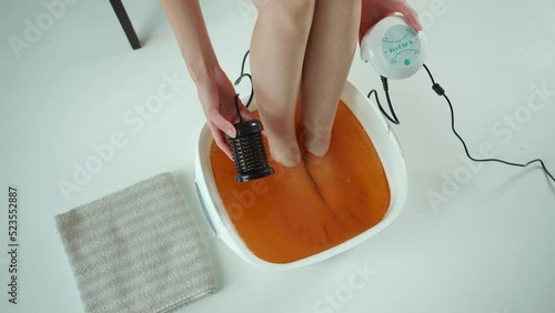 procedure of ionic detox foot bath machine in spa beauty center isolated 4k