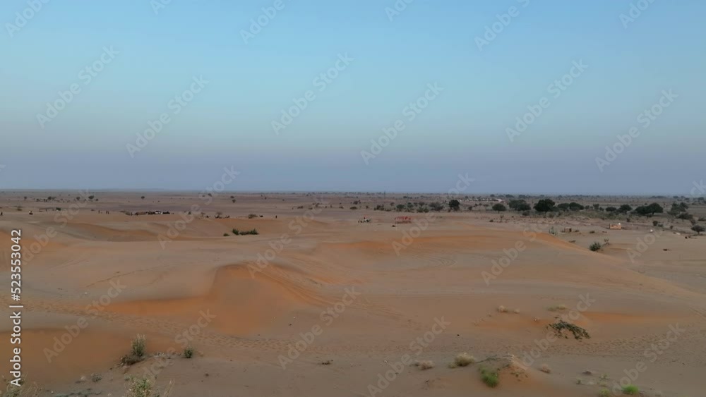 Aerial Forward Shot Of Tourists Exploring Desert On Vacation - Jaisalmer, India Aerial Forward Shot Of Tourists Exploring Desert On Vacation - Jaisalmer, India