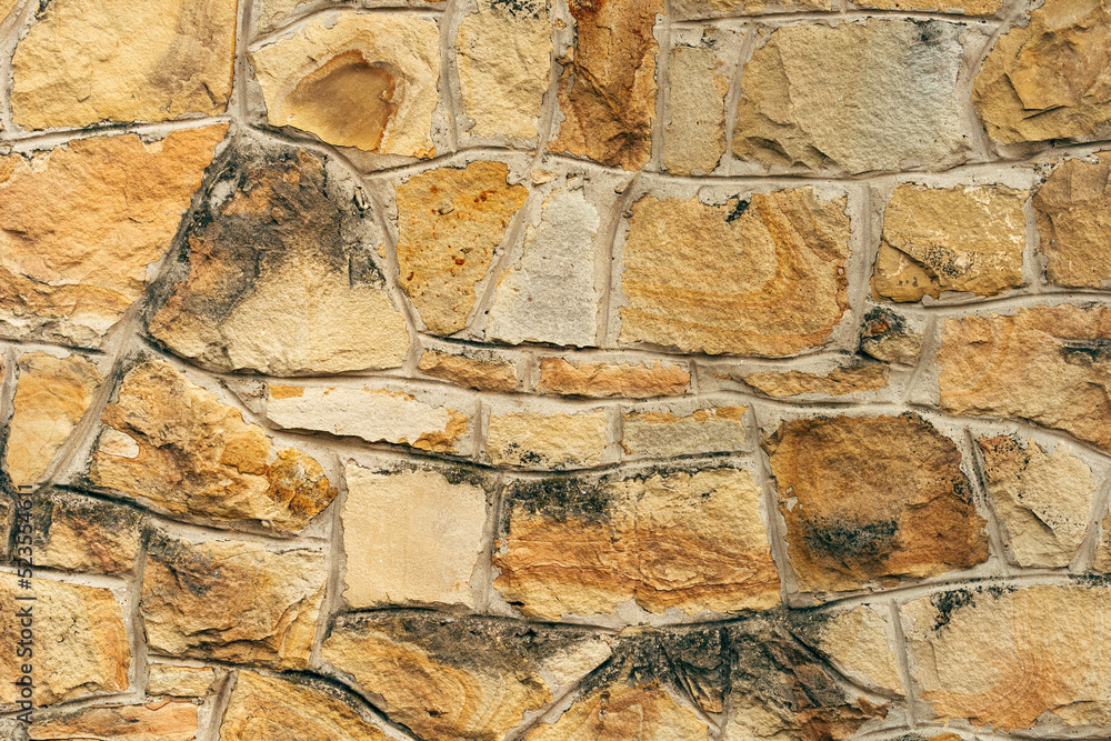 Fototapeta premium Texture of wall cladding with broken stone
