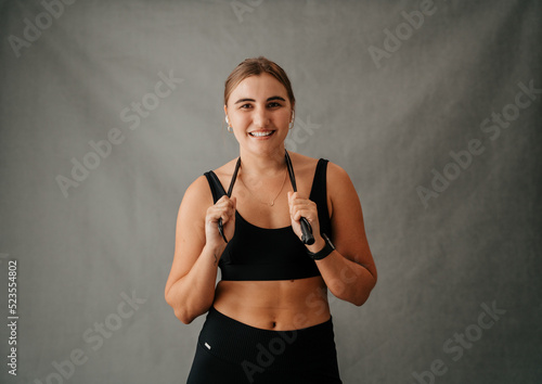  Close up Caucasian female skipping rope around her neck