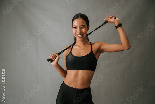 Close up vibrant multiethnic female posing with skipping rope