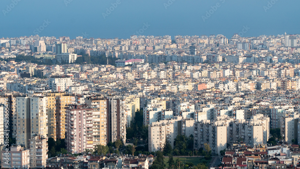 Obraz premium Urban jungle, multi-storey stone houses against the sky - the background of the city