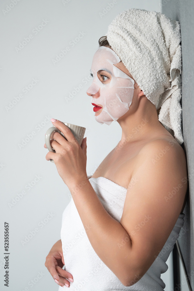 Facial care, a girl and a fabric mask on her face. Facial care, a girl and a fabric mask on her face.