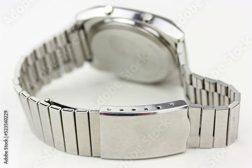 Fotografie backside of a digital watch silver vintage retro wristwatch 70s 80s isolated ala