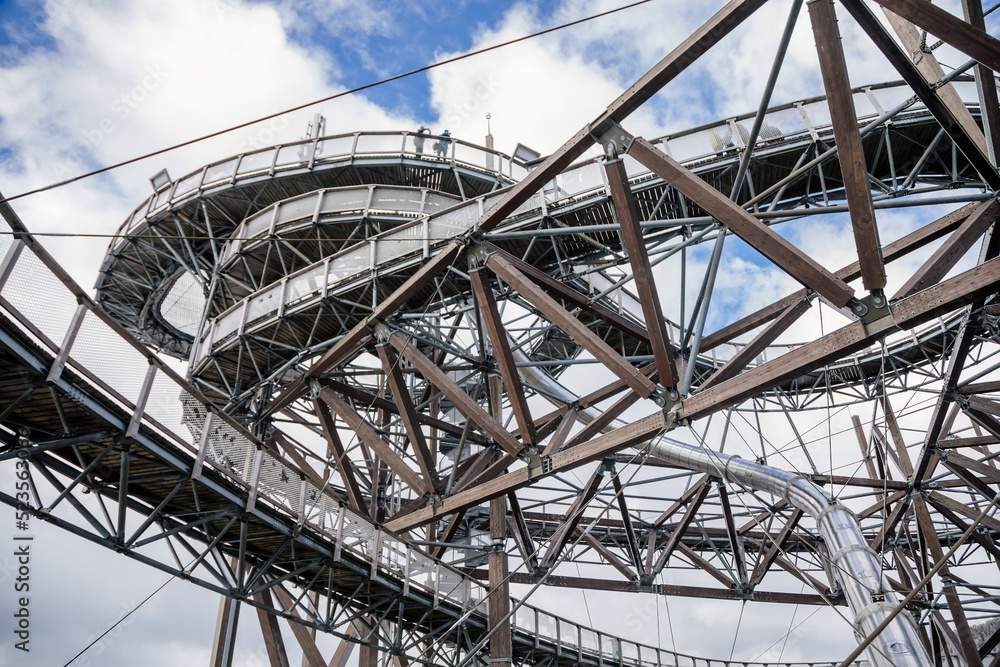 Dolni Morava, Czech Republic, 16 April 2022: Path in the clouds, tourist attraction with spiral platform to observation tower, landscape with forest and sky on mountains, Skywalk with snow Dolni Morava, Czech Republic, 16 April 2022: Path in the clouds, tourist attraction with spiral platform to observation tower, landscape with forest and sky on mountains, Skywalk with snow