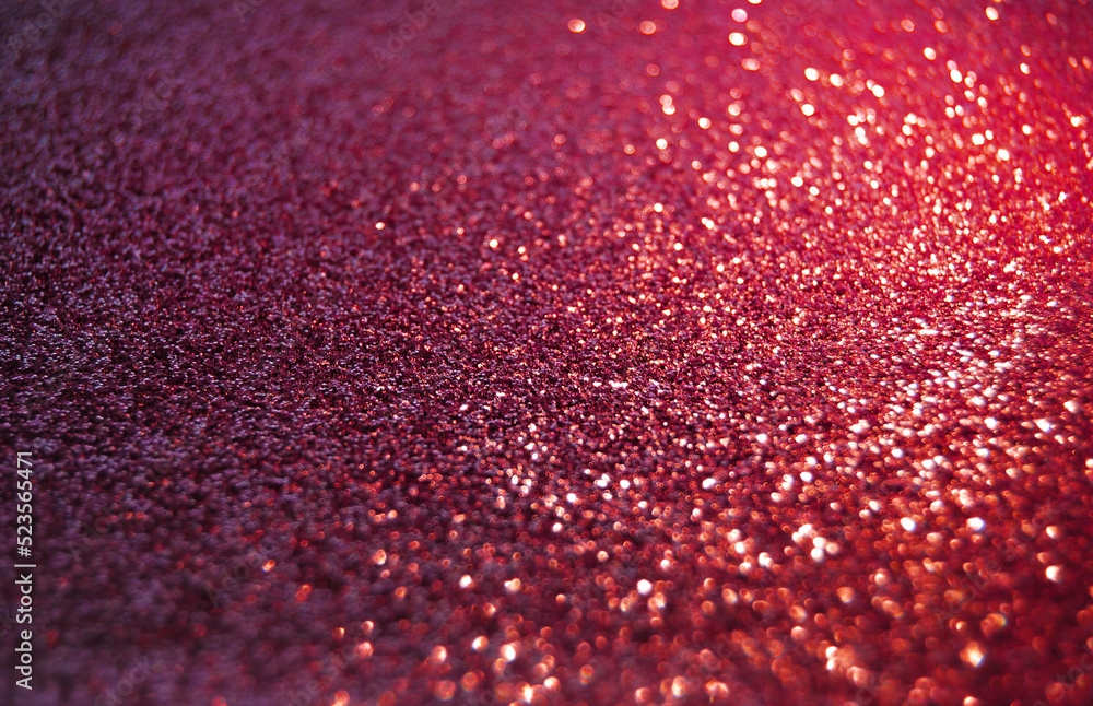 Purple de focused sparkle glitter background with golden particles close up Purple de focused sparkle glitter background with golden particles close up