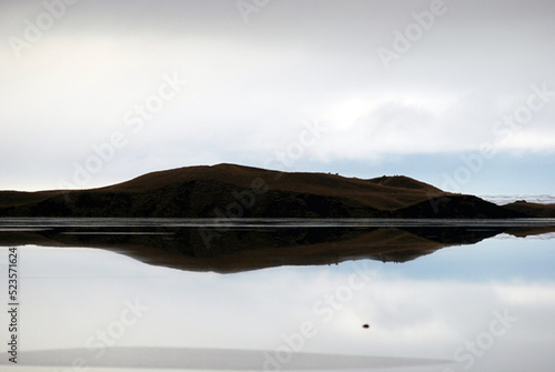 Mountain reflected on a lake © Aruna