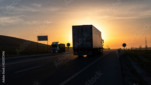 Vehicles exporting at sunrise view