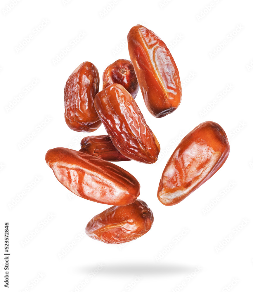 Tasty dried dates in the air closeup isolated on a white background Tasty dried dates in the air closeup isolated on a white background