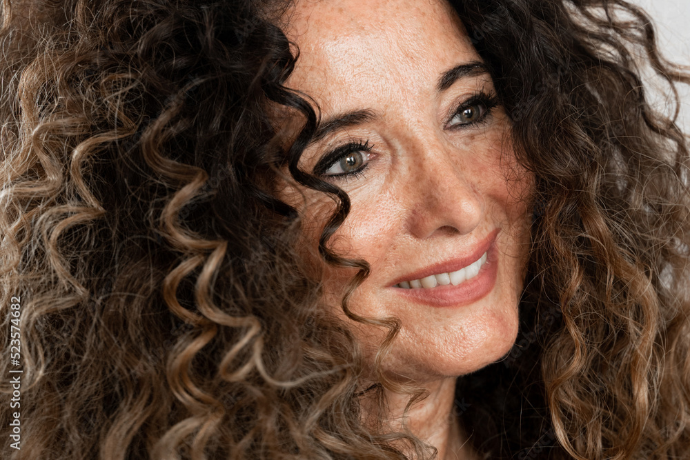 Portrait of a distracted beauty woman with curly hair Portrait of a distracted beauty woman with curly hair