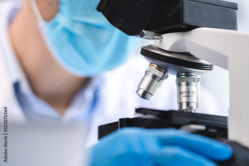 biotechnology scientist using scientific microscope for research in biology medicine laboratory, equipment for chemistry science or microbiology analysis in term of medical technology experiment biotechnology scientist using scientific microscope for research in biology medicine laboratory, equipment for chemistry science or microbiology analysis in term of medical technology experiment