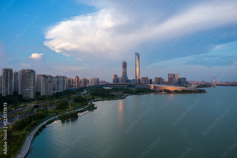 Aerial view of city skyline and modern buildings scenery in Suzhou at sunset, China.