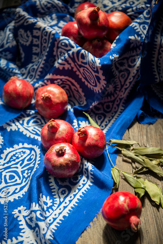 Azerbaijani national national silk scarf called Kelagayi still life with pomegranates studio shooting photo