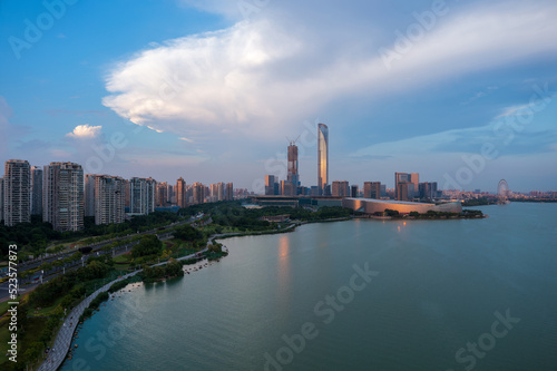 Aerial view of city skyline and modern buildings scenery in Suzhou at sunset, China.