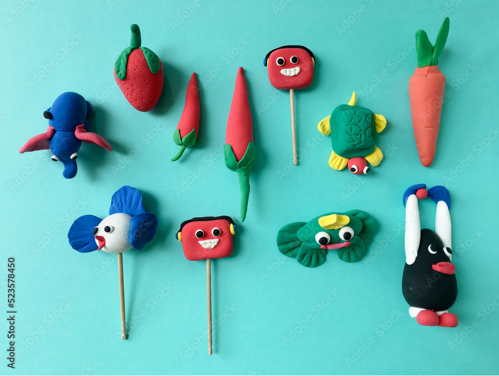 Various colorful models of animals and fruits made by kids using soft clay  dough. Cute and colorful clay figures made by children. Stock Photo | Adobe  Stock