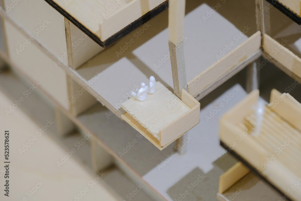 Super close up view of sample architectural model with miniature figurines of couple; macro view, selective focus. Super close up view of sample architectural model with miniature figurines of couple; macro view, selective focus.