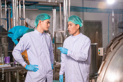 Asian man employee working in food Factory industry