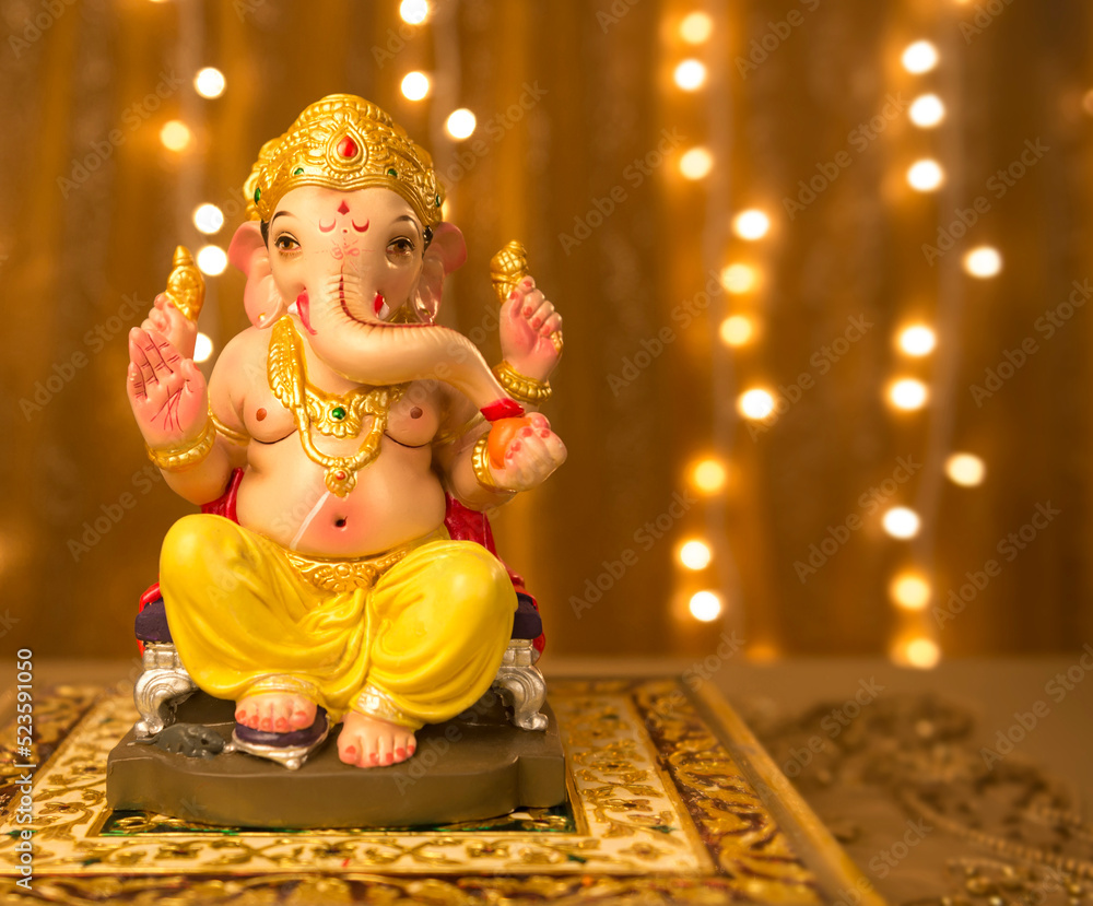 Beautiful Ganesha idol against decorative background. Clear space ...