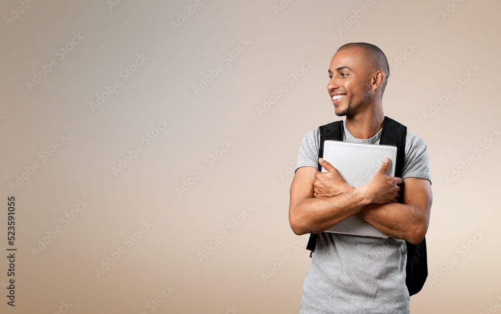 Happy school, college or university student with backpack. Cheerful handsome young man smiling Happy school, college or university student with backpack. Cheerful handsome young man smiling