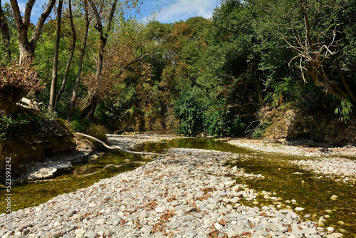 The Natisone river during the 2022 drought as it flows through the north east Italian village of Premariacco, Udine Province, Friuli-Venezia Giulia. Normally a very busy swimming spot during the summe