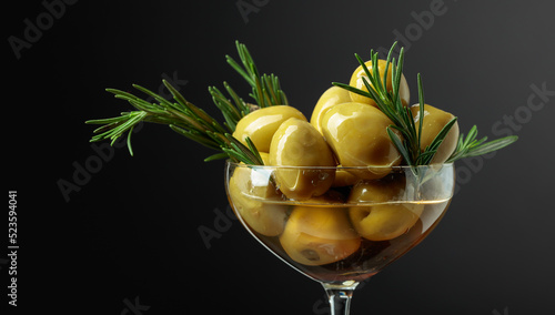 Green olives with rosemary.