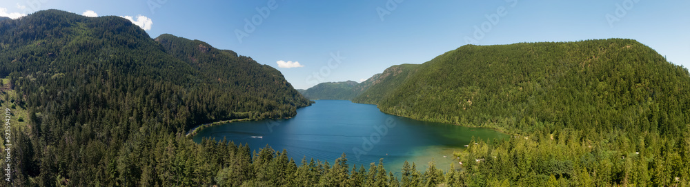 Aerial Panoramic View of Cameron Lake during a vibrant sunny day. Vancouver Island, British Columbia, Canada. Canadian Nature Background Aerial Panoramic View of Cameron Lake during a vibrant sunny day. Vancouver Island, British Columbia, Canada. Canadian Nature Background