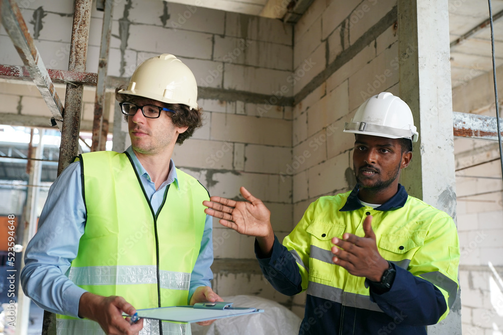 Architect and construction engineer or surveyor discussion plans and blueprints Architect and construction engineer or surveyor discussion plans and blueprints