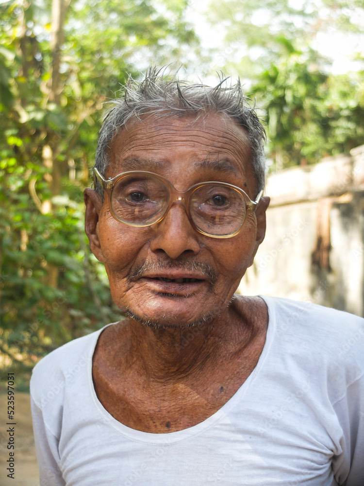 close up Portrait of south asian aged grandfather close up Portrait of south asian aged grandfather