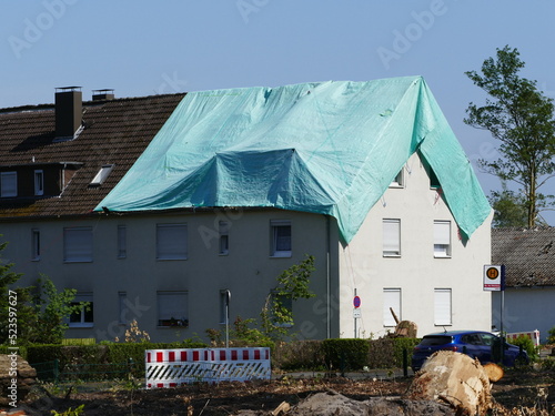 May 2022 a tornado caused severe damage in Lippstadt, North Rhine-Westphalia, Germany, here a makeshift tarpaulin lies on a roof