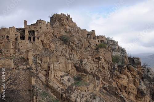 Ruins of abandoned ghost village Gamsutl at top of mountain peak in Dagestan, North Caucasus, Russia