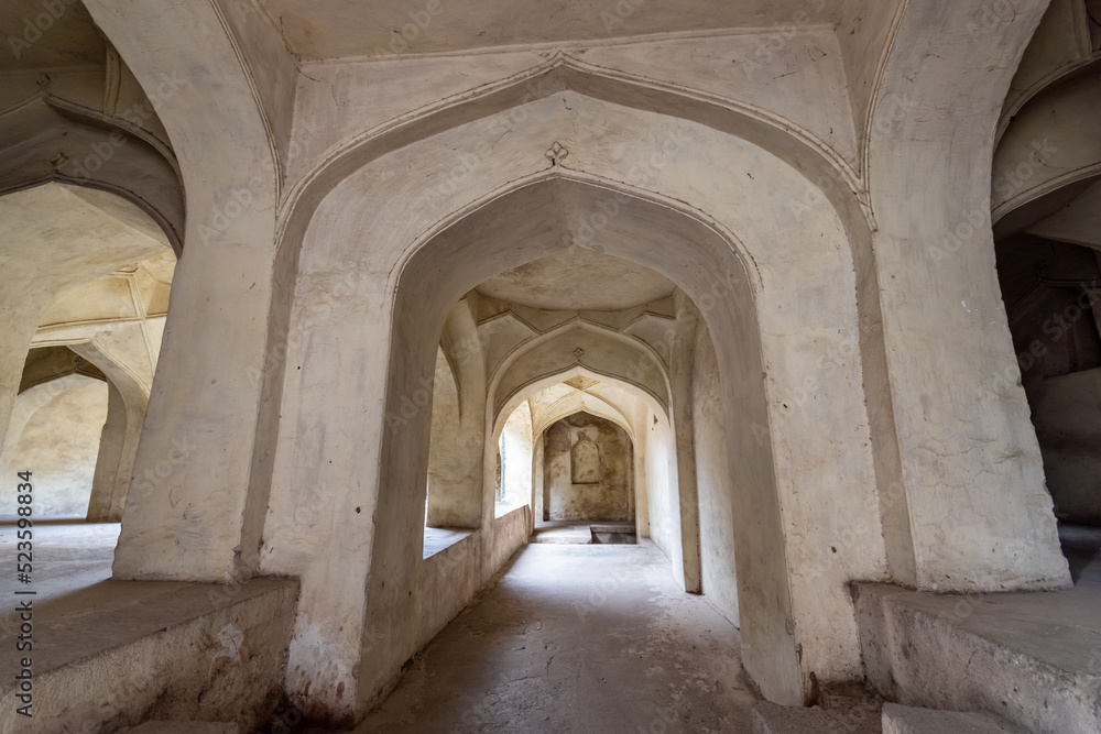 The stone arches of a hall at the ancient historic heritage site of Golconda Fort in Hyderabad.