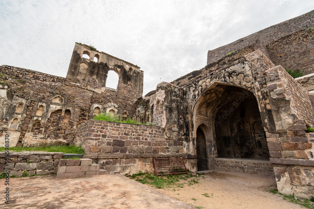 The stone walls of the ruins of the ancient historic Golconda fort in the city of Hyderabad in Telangana, India.