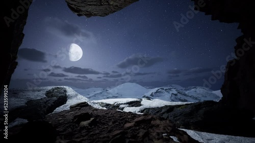 Epic and fantasy view of snowy mountains from a cave. 3d render