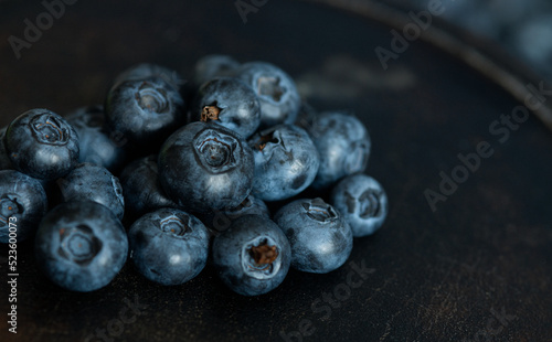 Blueberries in a bowl. Blueberries on a dark aged background.
