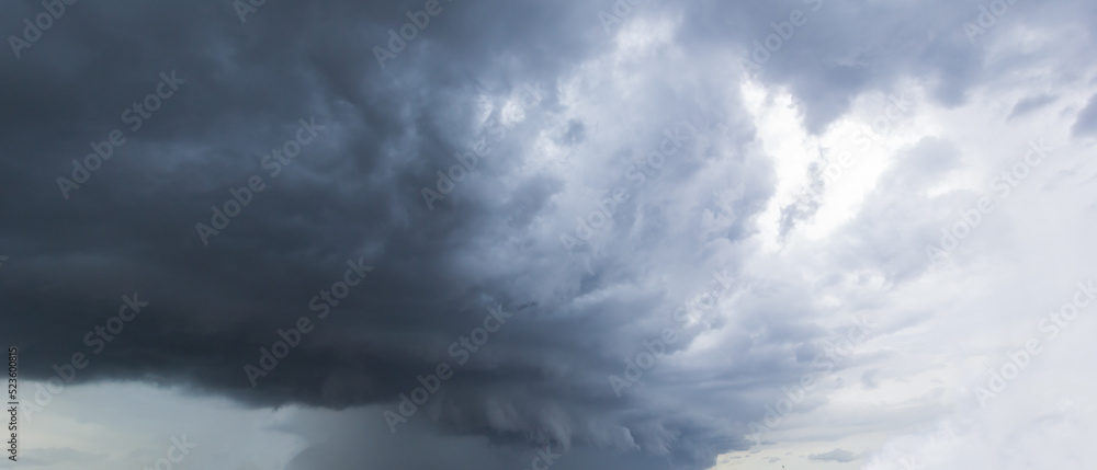 The dark sky with heavy clouds converging and a violent storm before the rain.Bad or moody weather sky and environment. carbon dioxide emissions, greenhouse effect, global warming, climate change. The dark sky with heavy clouds converging and a violent storm before the rain.Bad or moody weather sky and environment. carbon dioxide emissions, greenhouse effect, global warming, climate change.